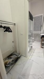 a bathroom with a walk in closet with shoes at Angels Venice in Marghera