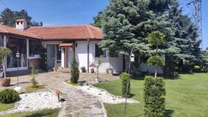 a house with a garden in front of it at Villa Toni in Varna City