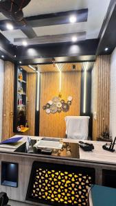 a office with a desk and a chair in a room at Satya Avenue Dehradun, Near Pearl Paradise IT park Road in Dehradun