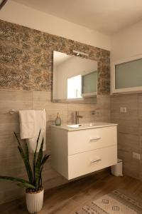 a bathroom with a sink and a mirror at Sarmalia 32 a pochi passi dal centro di Nardò in Nardò