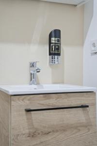 a sink with a faucet in a bathroom at Schwarzwald Ledi - Bed & Breakfast Feldberg in Feldberg +85 photos