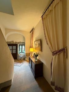 a living room with a table and a window at Château de Savigny - Suite Eau in Savigny