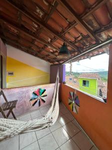 a hammock in a room with a view at Jahospedaria & Ecoturismo in Lençóis