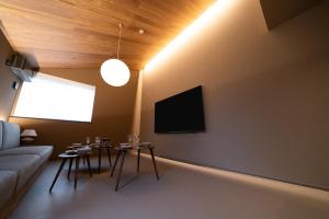 a living room with a couch and a table at Mon Hotel HAKATA in Fukuoka +44 photos