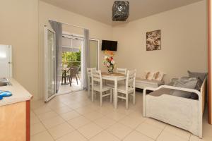 a kitchen and living room with a table and chairs at Dion Zois in Finikounta +24 photos
