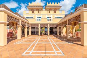 a rendering of the courtyard of a building at OBSIDIAN Granada Park in Arona