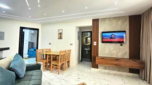 a living room with a couch and a table at 2bed rooms chalet portosaid in Port Said