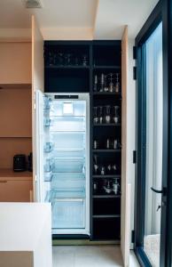 an open refrigerator with its door open in a kitchen at Vakantiewoning number 44 in Ieper