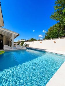 a swimming pool in the backyard of a house at La Costa Rooms in Flumini di Quartu