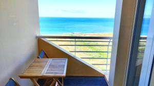 a balcony with a table and a view of the ocean at Dorisol Vista Formosa by Rentallido in Funchal