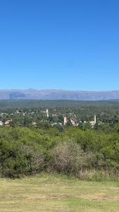 a view of a city from the top of a hill at Fincas del Faldeo in Villa General Belgrano