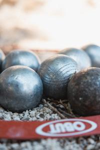 a pile of balls sitting on top of gravel at Domaine des Druides in Apt +32 photos