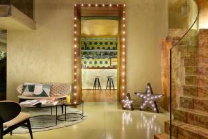 a living room with a table and a star at Enterprise Hotel Design & Boutique in Milan
