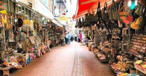 a market with people walking through a market with merchandise at Yıldız Pansiyon in Amasra