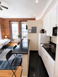 a kitchen with a sink and a counter top at Empire State & nest in New York
