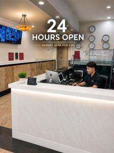 a man sitting at the counter of a hours open store at Empire State & nest in New York