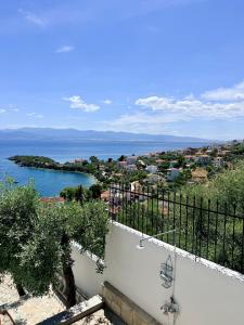 a view of the ocean from a balcony at Blue Horizon Balcony in Volos