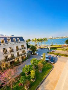 an aerial view of a city with palm trees and the ocean at Fame Apartment in Dong Hoi