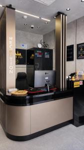 a lobby with a counter with a pizza on it at Bazaar Inn Boutique & Luxury Rooms in Skopje
