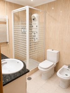 a bathroom with a shower and a toilet and a sink at PORTO AGUDA BEACH ***** in Arcozelo +10 photos