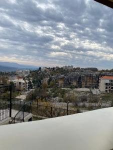 a view of a city from a balcony at Chalet 103 - Zresidence - Faitroun in Al ‘Aqabah