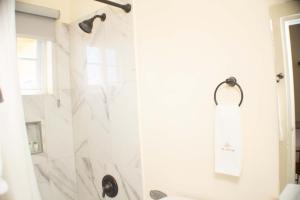 a bathroom with a shower with a shower curtain at The Vista Inn Studio #2 in Falmouth