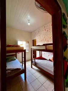 a room with two bunk beds and a window at Jahospedaria & Ecoturismo in Lençóis