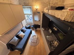 an overhead view of a room with a couch and a bed at Via Corradi in Sanremo