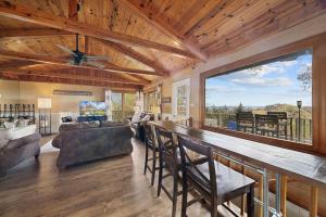 a bar in a living room with a large window at Blowing Rock Skies in Lenoir +11 photos