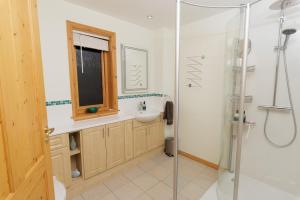a bathroom with a sink and a shower at Quoys Self Catering, Shetland in Lerwick +58 photos