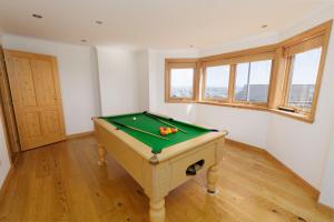 a room with a pool table in it at Quoys Self Catering, Shetland in Lerwick