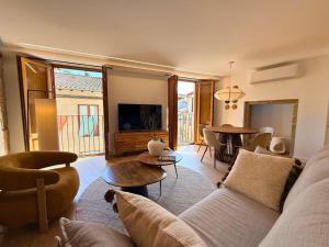a living room with a couch and a table at YourHouse O Rexo in Allariz