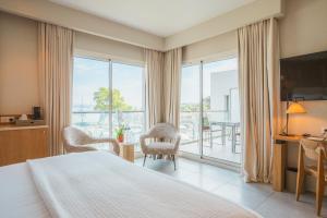 a hotel room with a bed and a balcony at Kube Saint-Tropez in Saint-Tropez +98 photos