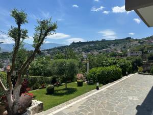 a view of a garden from a house at Ilvi Guesthouse in Gjirokastër