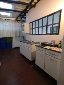 a kitchen with a sink and a counter top at Tour La Matrona in Villa de Leyva