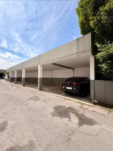 a garage with a car parked in it at Sorpesee Stay in Sundern
