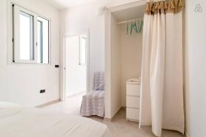 A bed or beds in a room at Casa Serradei