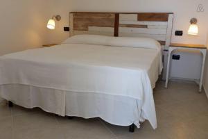A bed or beds in a room at Casa Serradei