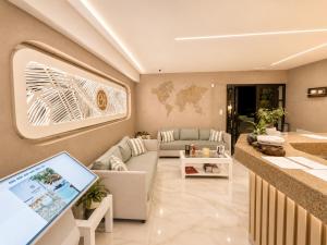a living room with a couch and a table at Castro Hotel in Amoudara Herakliou