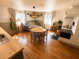 a living room with a table and a couch at HomeSweetSweden in Malung