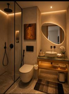 a bathroom with a toilet and a sink at Auralys Seaside Studio avec balcon in Casablanca +4 photos
