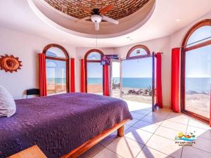a bedroom with a bed and a view of the ocean at Casa Serenity Beachfront Rental in San Felipe