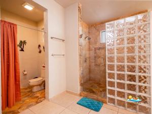 a bathroom with a shower and a toilet at Casa Serenity Beachfront Rental in San Felipe +24 photos