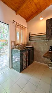 a kitchen with a stove and a counter top at Liokorni Village in Gaios +76 photos