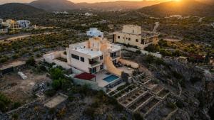 an aerial view of a large white house at Seeq view in Sayq