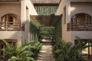 an internal courtyard of a house with plants at Casa Joseph Troncones - Adults Only in Troncones