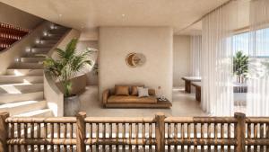 a living room with a couch and a staircase at Casa Joseph Troncones - Adults Only in Troncones