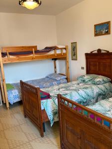 a bedroom with two bunk beds in a room at Residenza Dei Castelli in Coredo