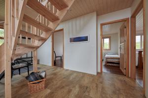 a room with a staircase and a bedroom at Brekka in Akranes
