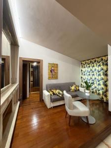 a living room with a couch and a table at Da Francesca guestrooms in Patrica